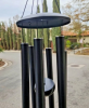 Wind chimes are a kind of jewelry made of metal, ceramic or wood, hanging in the outdoor, the wind emits a crisp sound, symbolizing blessings and good, often used to decorate the room and bring peace and quiet atmosphere.