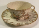 The tea cups are made of different materials, some are delicate porcelain, some are thick purple sand, and some are simple glass. Each material gives off a different temperature and smell. The warmth of the porcelain cup, like a soft whisper.