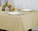 The use of tablecloths is not limited to the dining room, many families will also use tablecloths in areas such as the living room. The tablecloth on the end table protects the surface while enhancing the overall beauty of the space.